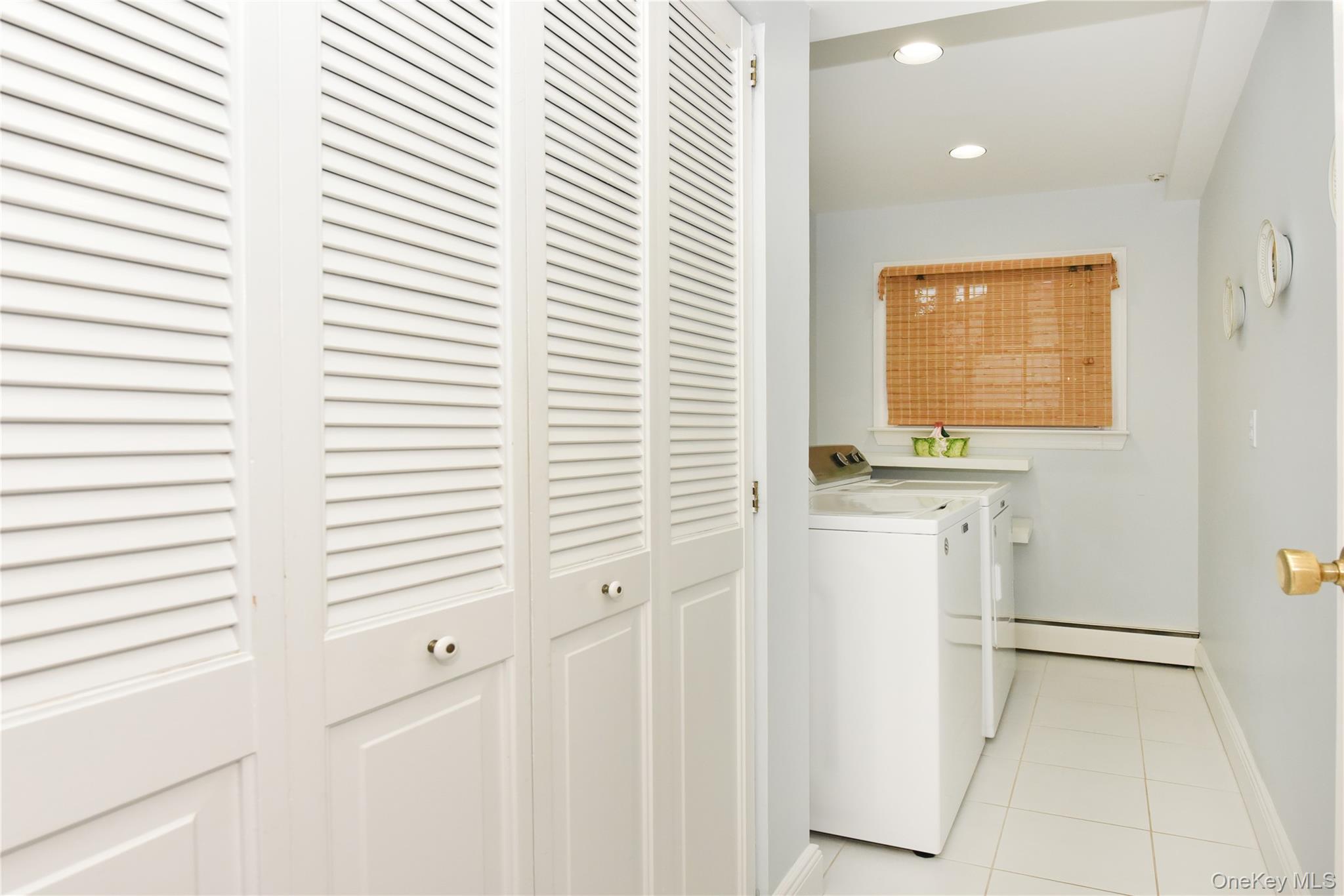 11 Joy Drive Manhasset Hills, NY 11040 - Photo 36 of 41 a bathroom with a sink and a window