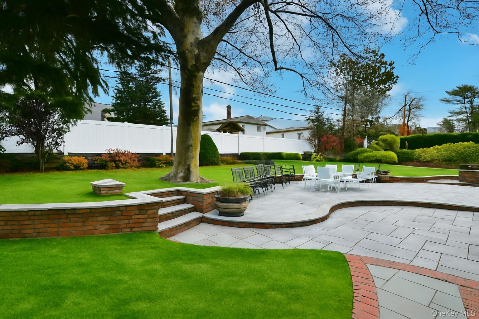 11 Joy Drive Manhasset Hills, NY 11040 - Photo 40 of 41 a view of a backyard with sitting area