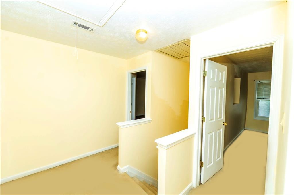 3440 Maple Valley Drive Cumming, GA 30040 - Photo 23 of 73 a bathroom with a mirror and a shower