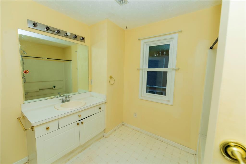 3440 Maple Valley Drive Cumming, GA 30040 - Photo 27 of 73 a bathroom with a sink and a mirror
