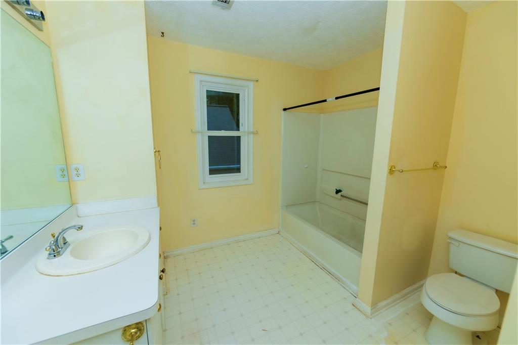 3440 Maple Valley Drive Cumming, GA 30040 - Photo 28 of 73 a bathroom with a sink and a shower