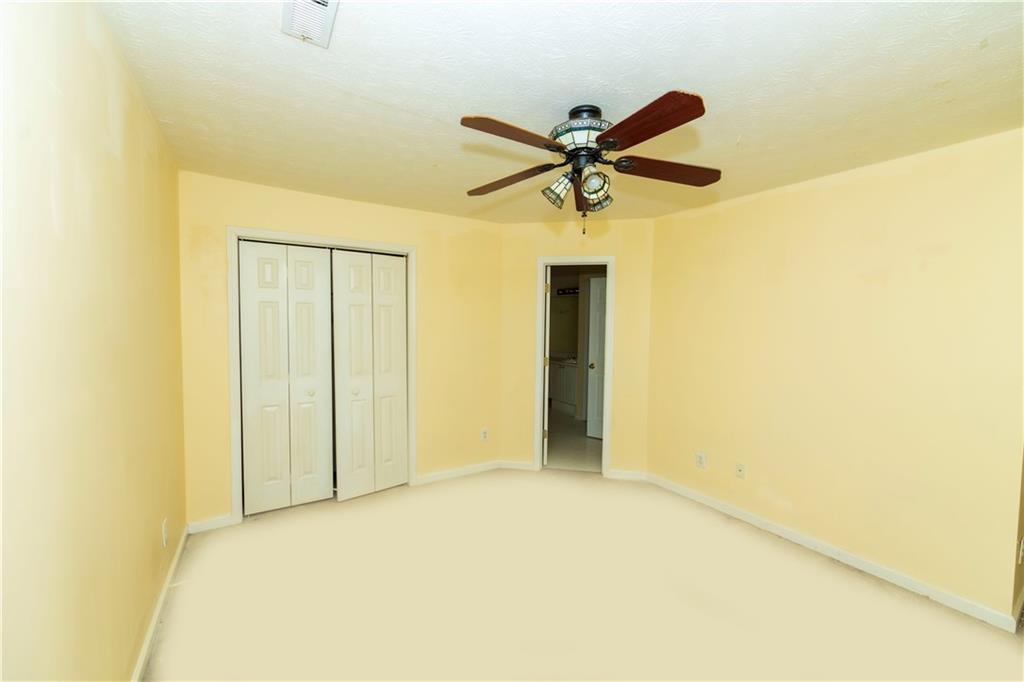 3440 Maple Valley Drive Cumming, GA 30040 - Photo 36 of 73 a view of a hallway with a ceiling fan