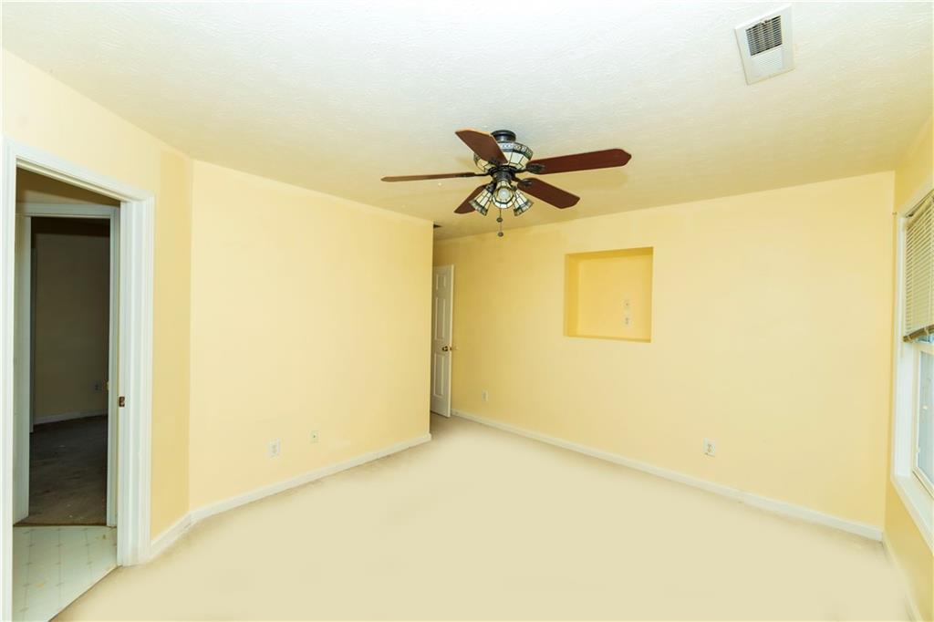 3440 Maple Valley Drive Cumming, GA 30040 - Photo 37 of 73 a view of a big room with a ceiling fan
