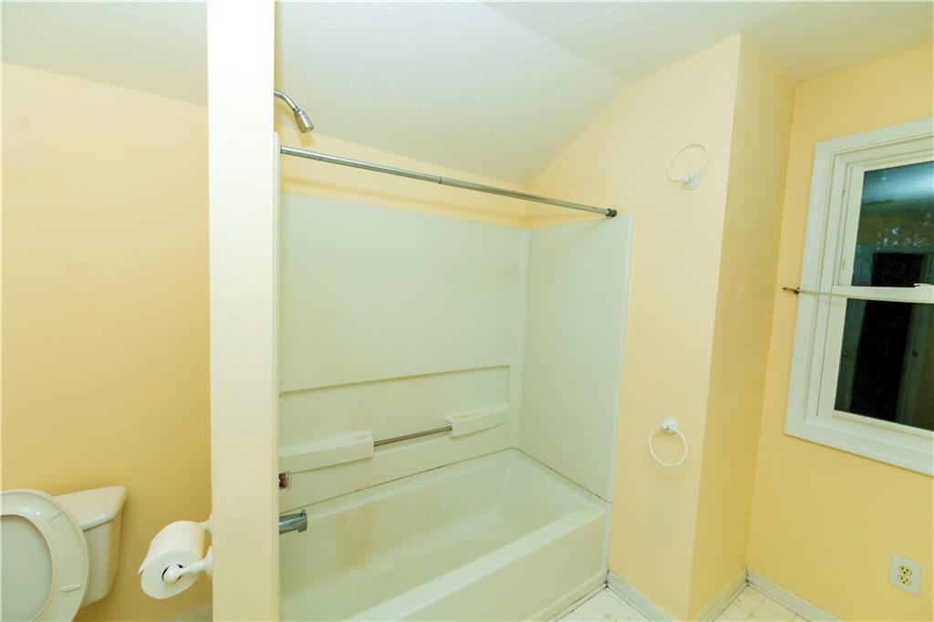 3440 Maple Valley Drive Cumming, GA 30040 - Photo 39 of 73 a bathroom with a bathtub