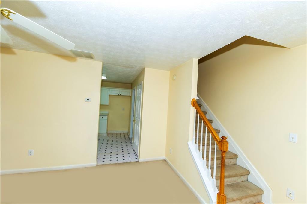 3440 Maple Valley Drive Cumming, GA 30040 - Photo 4 of 73 a view of a hallway with wooden floor and staircase