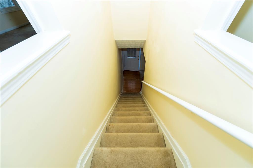 3440 Maple Valley Drive Cumming, GA 30040 - Photo 47 of 73 a view of a hallway with wooden floor