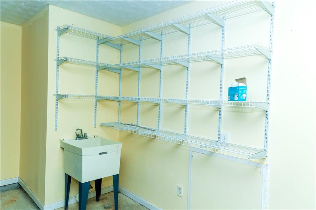 3440 Maple Valley Drive Cumming, GA 30040 - Photo 58 of 73 a bathroom with a sink and mirror