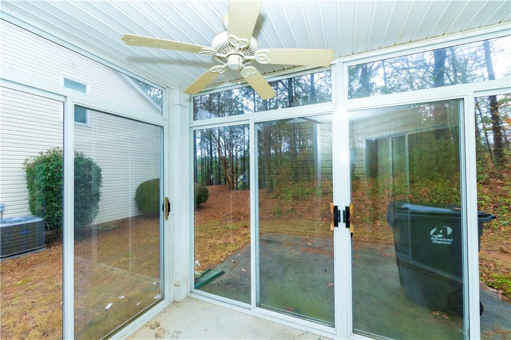 3440 Maple Valley Drive Cumming, GA 30040 - Photo 62 of 73 a bathroom with a glass shower door and a glass door