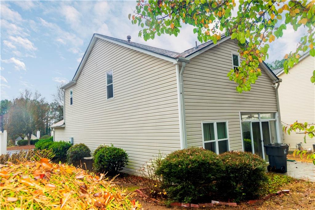 3440 Maple Valley Drive Cumming, GA 30040 - Photo 69 of 73 a view of a house with a yard and potted plants