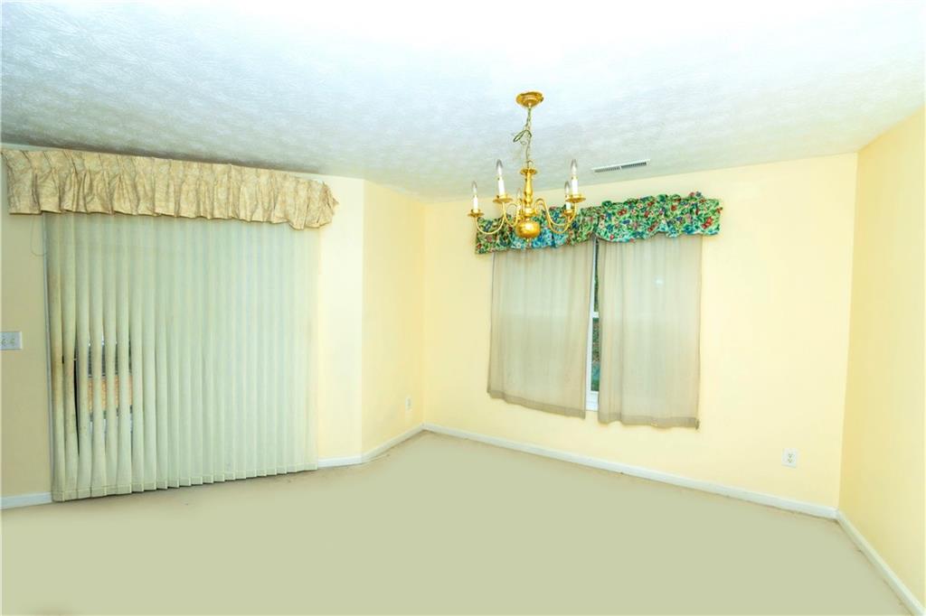 3440 Maple Valley Drive Cumming, GA 30040 - Photo 7 of 73 a view of a room with a windows