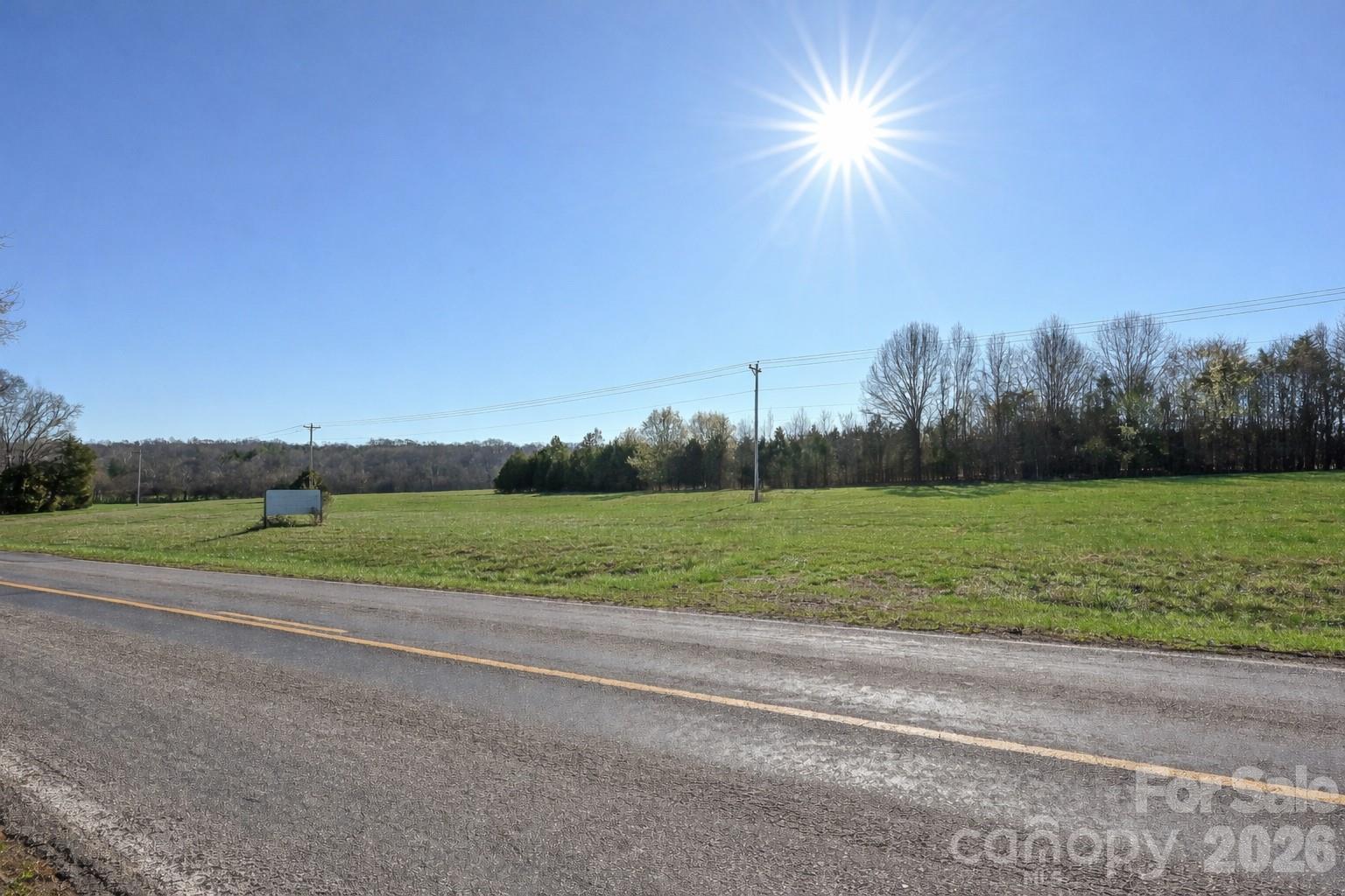 13.32 Patterson Farm Road Mooresville, NC 28115 - Photo 5 of 15 a view of a field with a big yard
