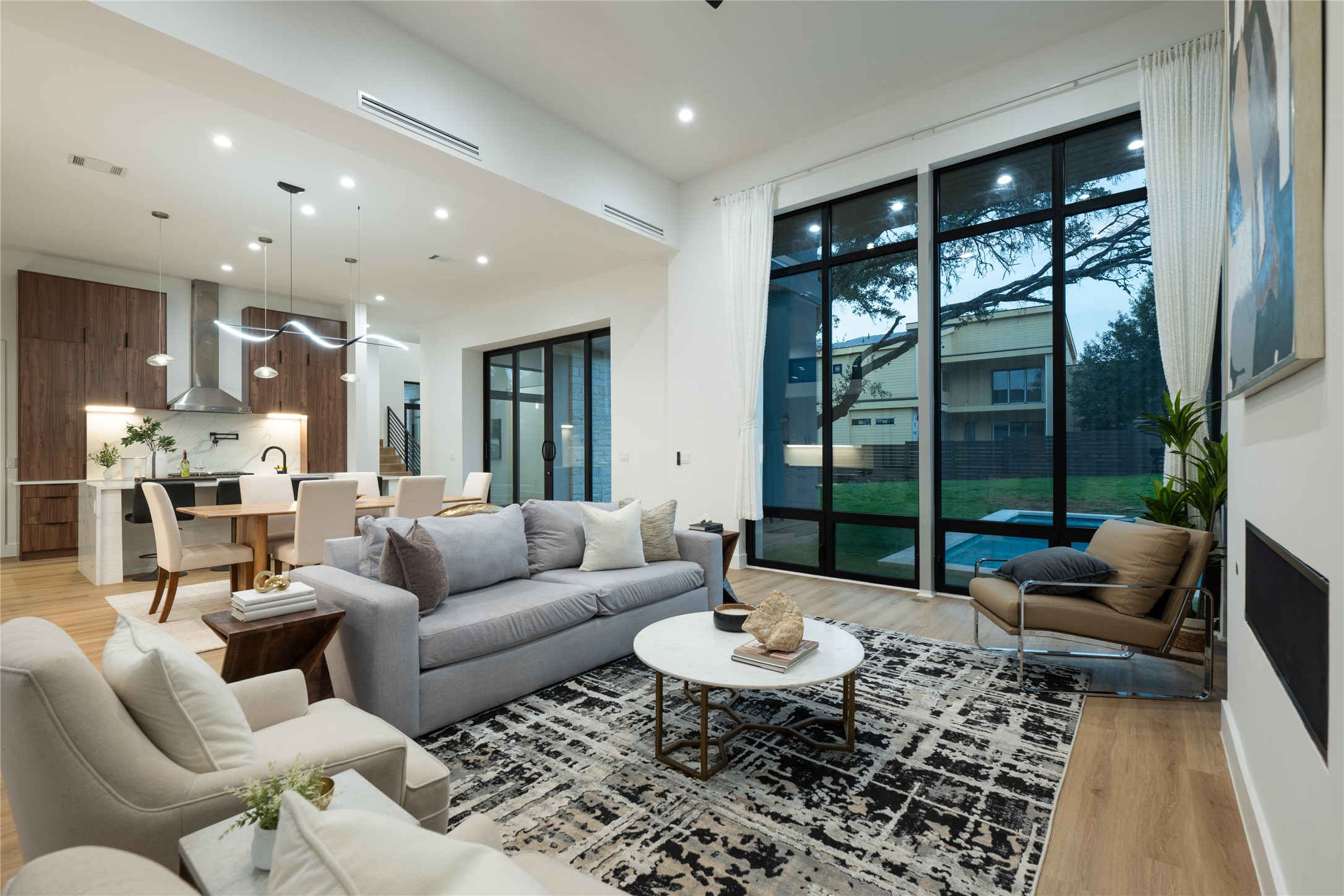 1108 Castile Road Austin, TX 78733 - Photo 3 of 24 Floor to ceiling windows at dusk are lovely.