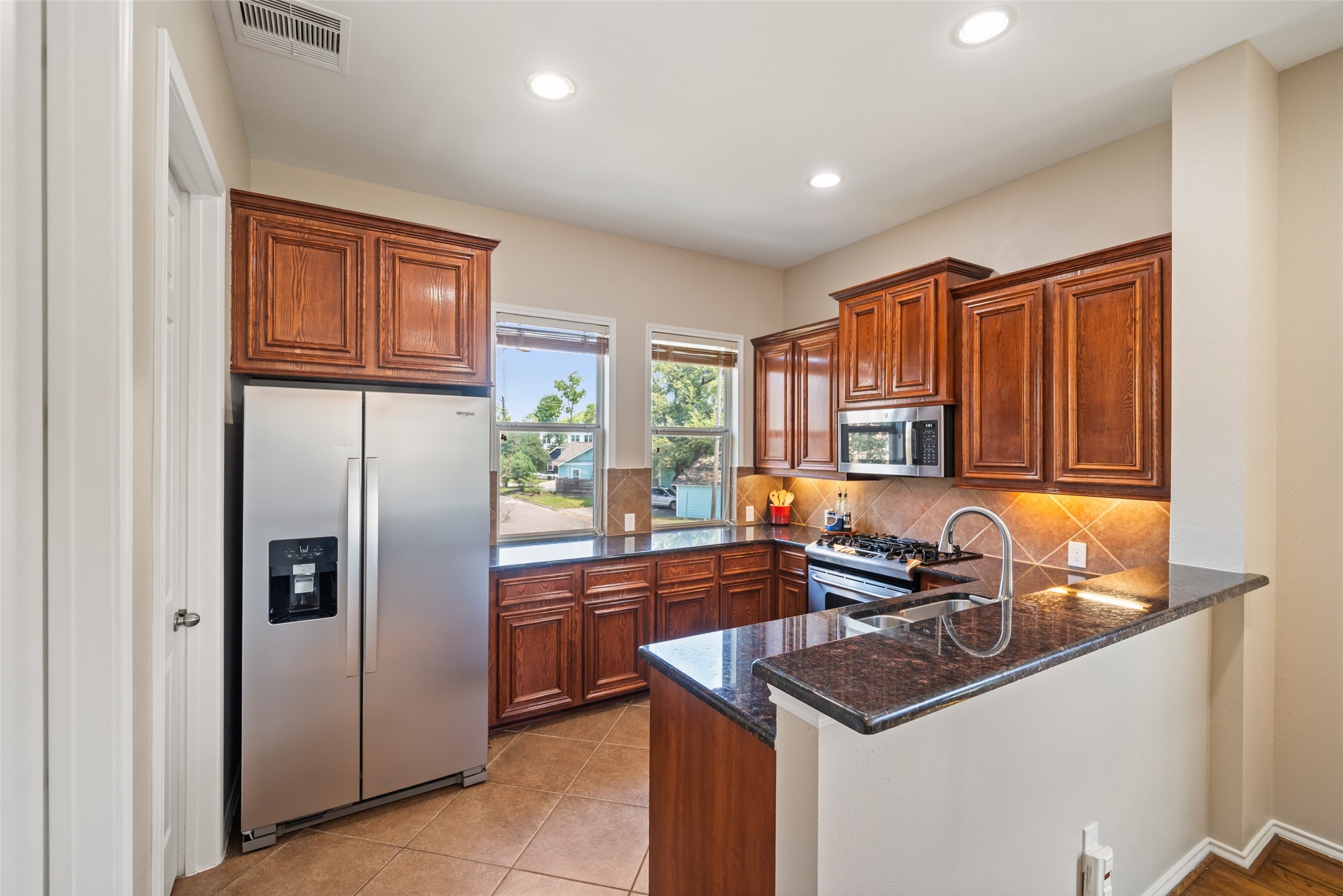 2613 Link Road Houston, TX 77009 - Photo 16 of 28 The kicthen offers plentiful cabinet storage and counter space.