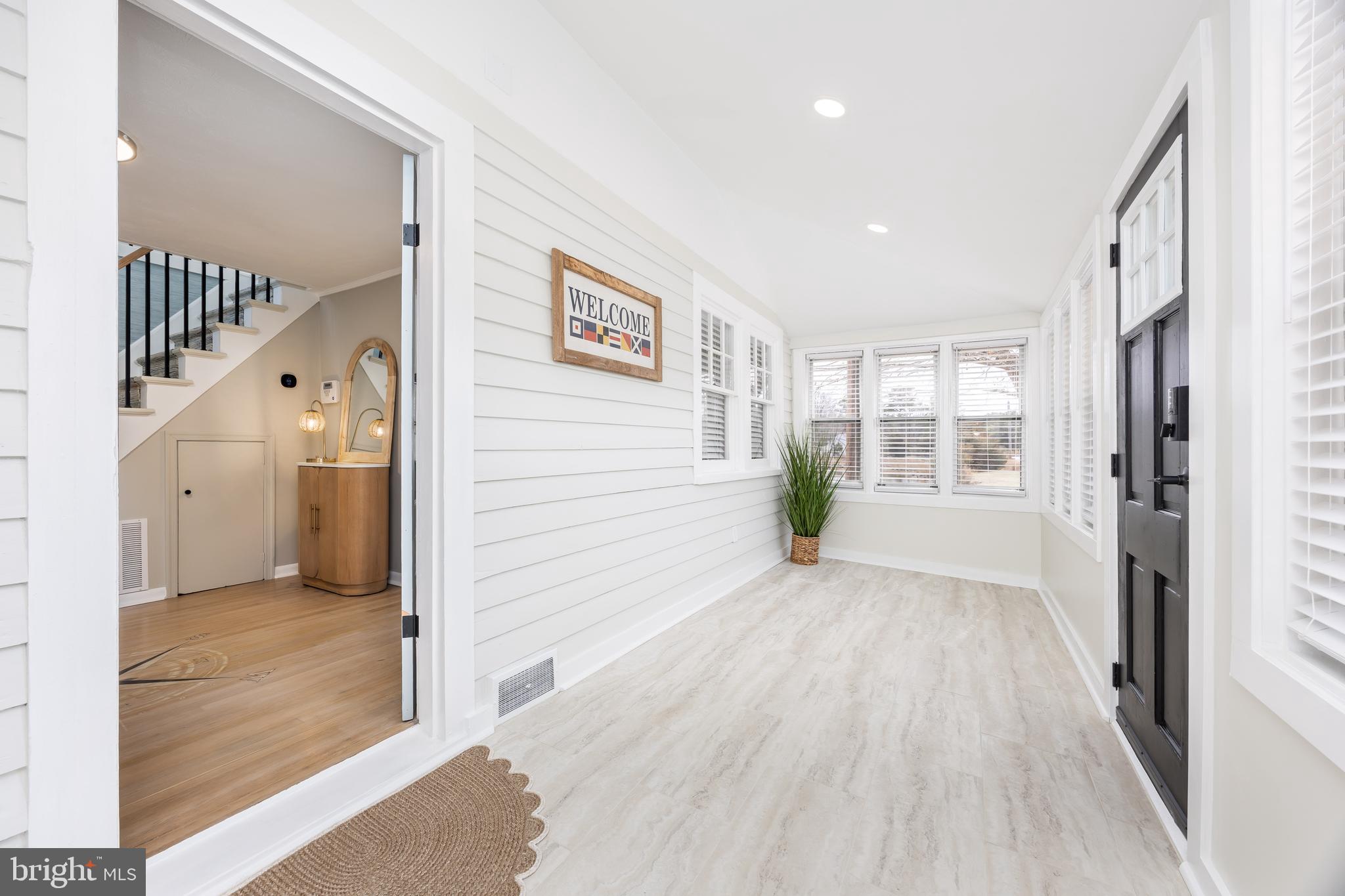 23057 Nanticoke Road Quantico, MD 21856 - Photo 44 of 75 a view of a hallway with wooden floor and entryway