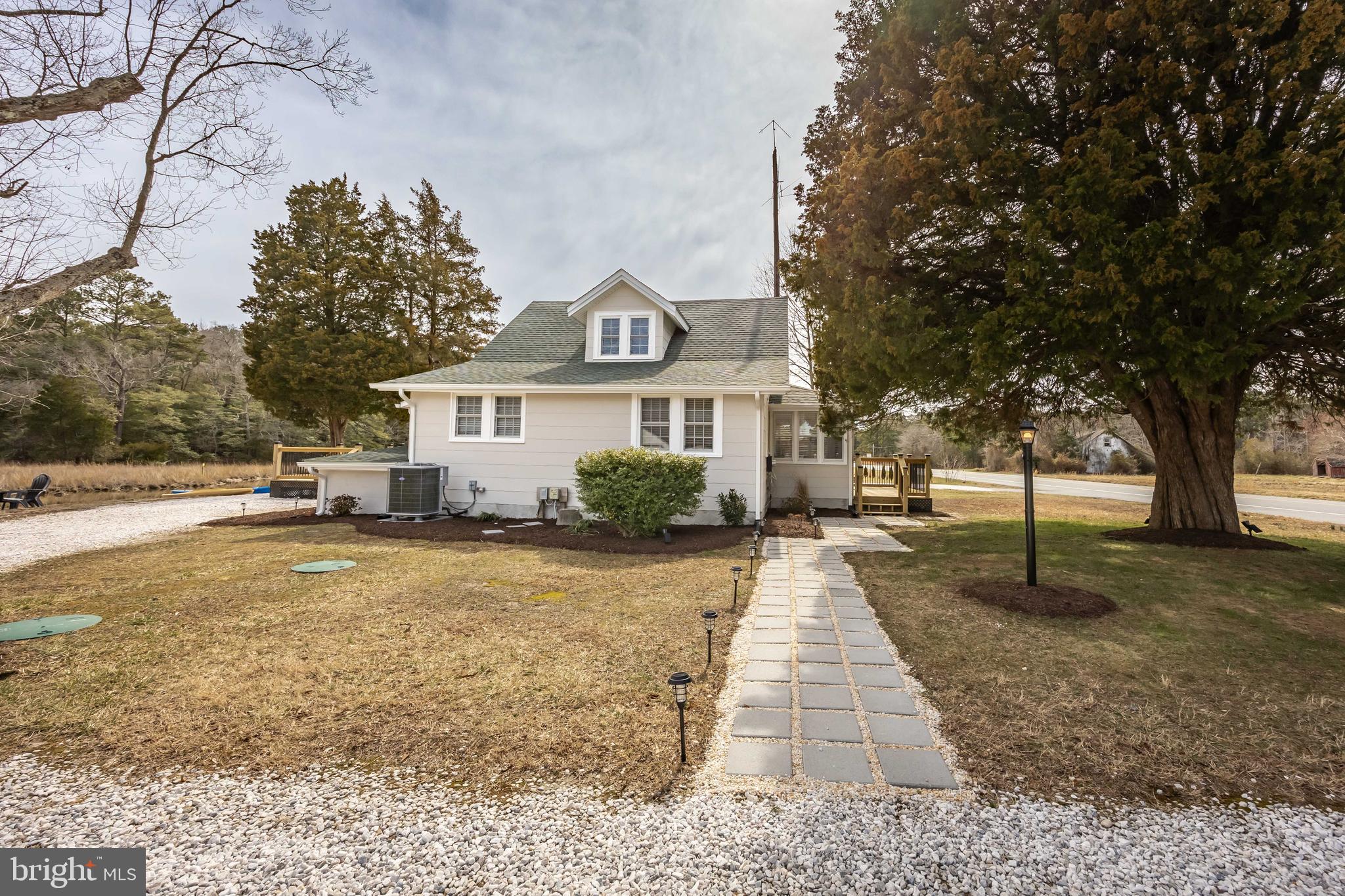 23057 Nanticoke Road Quantico, MD 21856 - Photo 74 of 75 a front view of a house with a yard and trees