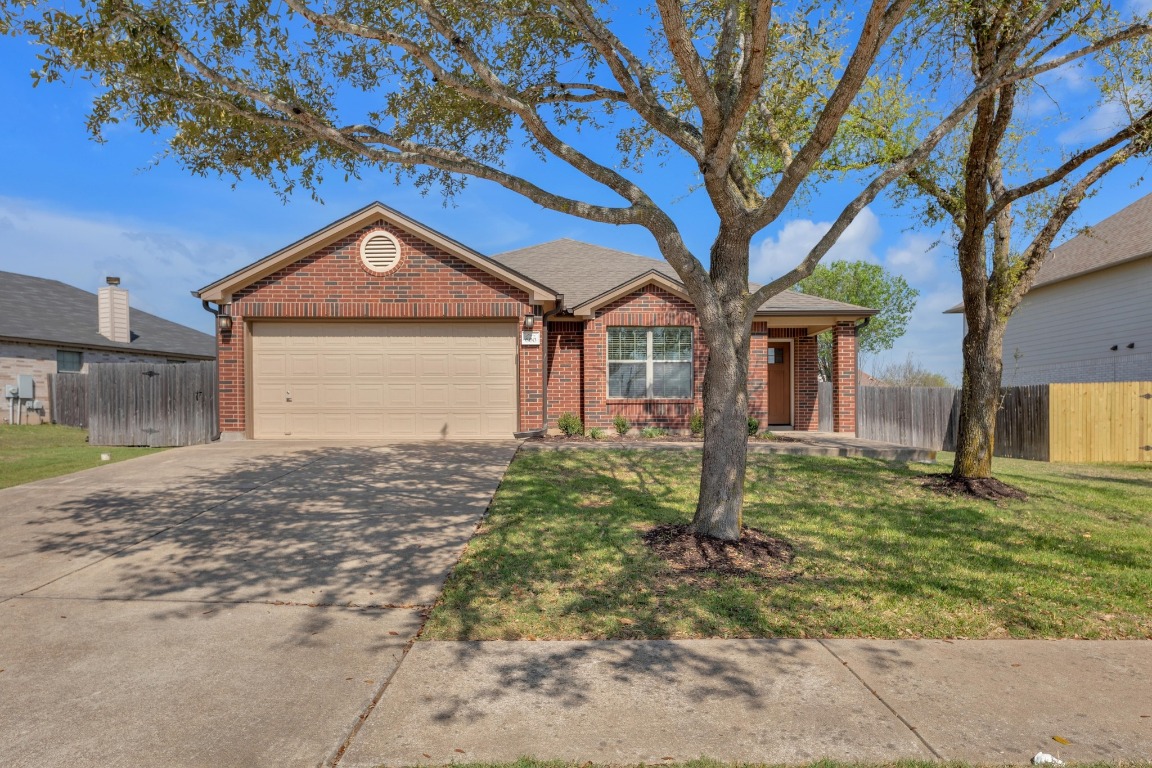 600 Dark Tree Lane Round Rock, TX 78664 - Photo 1 of 1 a front view of a house with garden