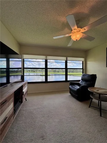 a room with furniture and a large window