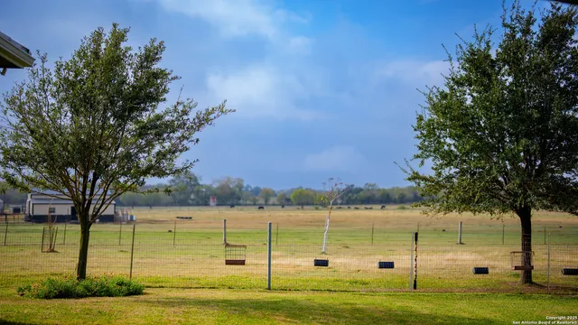 a view of a lake with a big yard