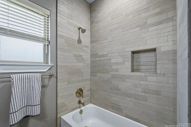 a bathroom with a sink and shower