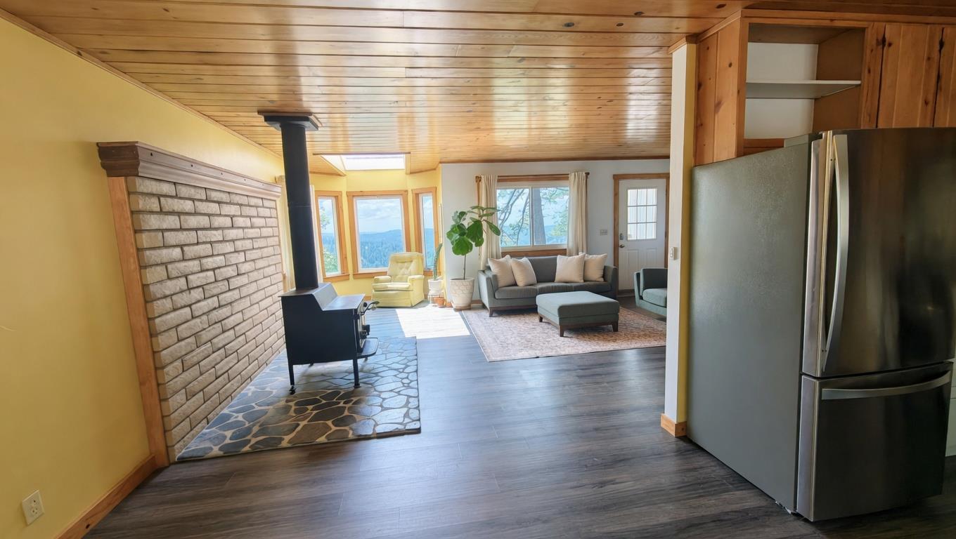 4850 8 Mile Road Camino, CA 95709 - Photo 8 of 30 a living room with furniture wooden floor and a large window