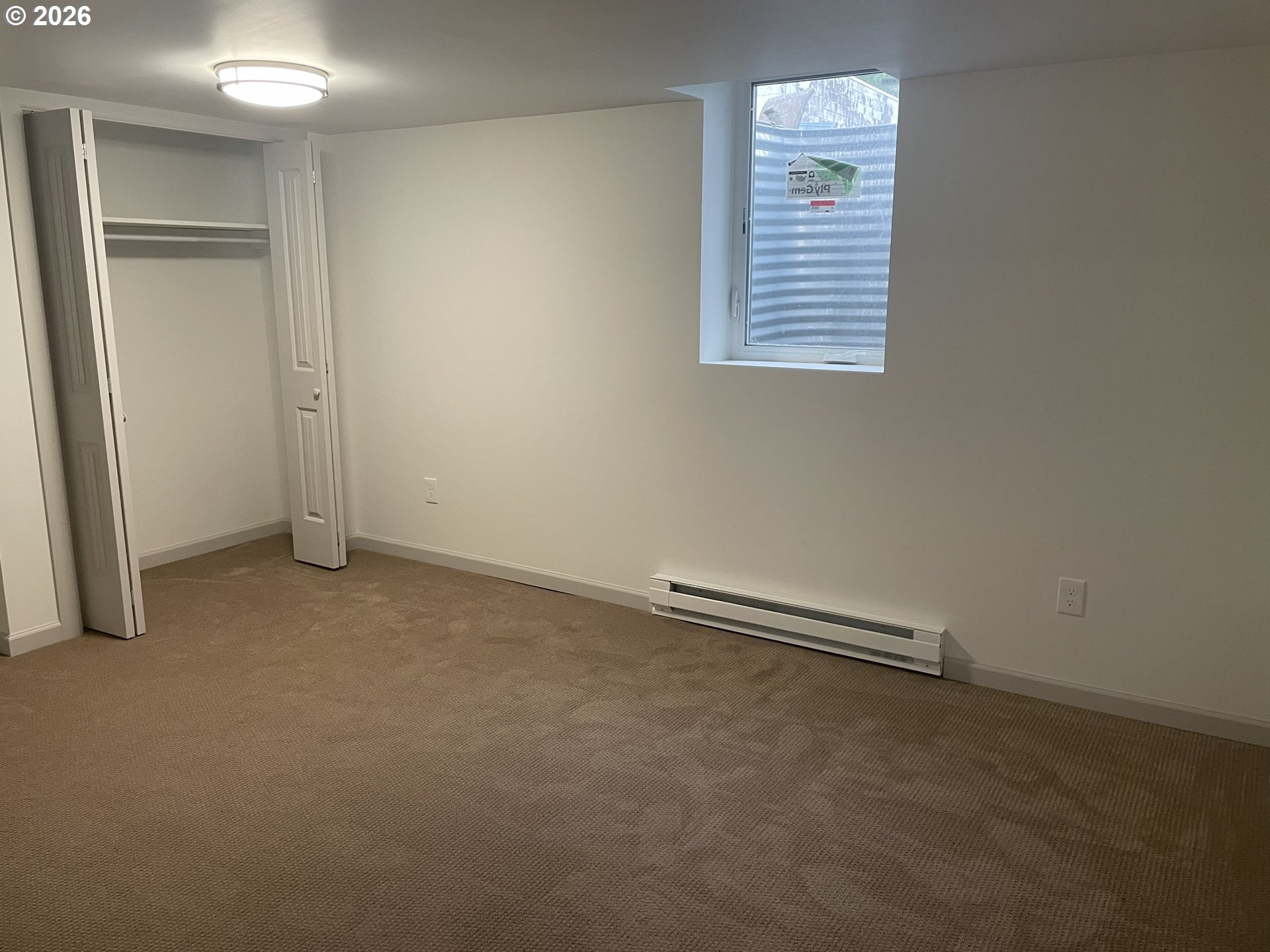 144 Southeast 85th Avenue Portland, OR 97216 - Photo 14 of 43 an empty room with a window
