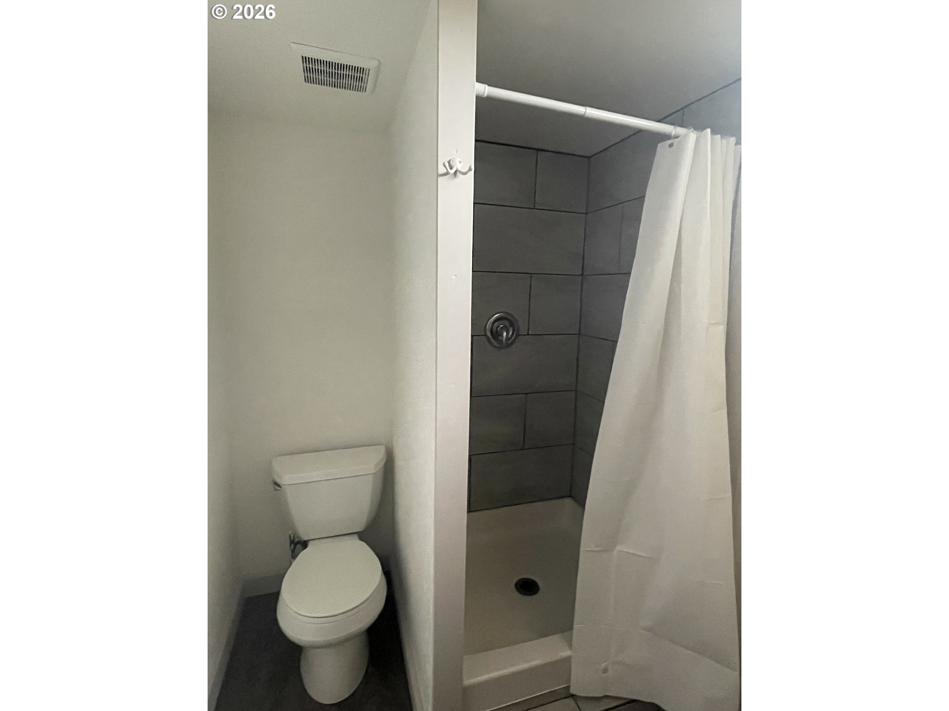 144 Southeast 85th Avenue Portland, OR 97216 - Photo 18 of 43 a bathroom with a toilet and a shower