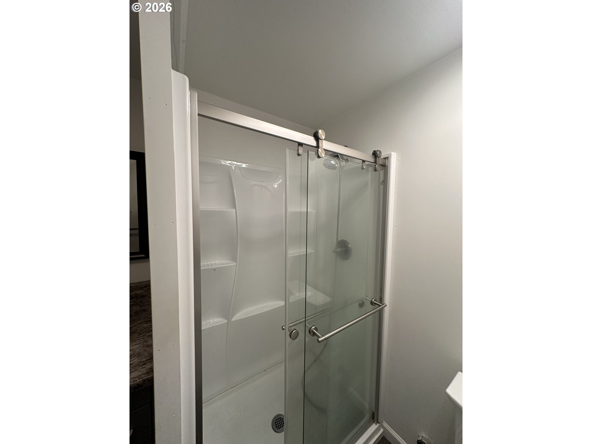 144 Southeast 85th Avenue Portland, OR 97216 - Photo 30 of 43 a bathroom with a shower and a toilet