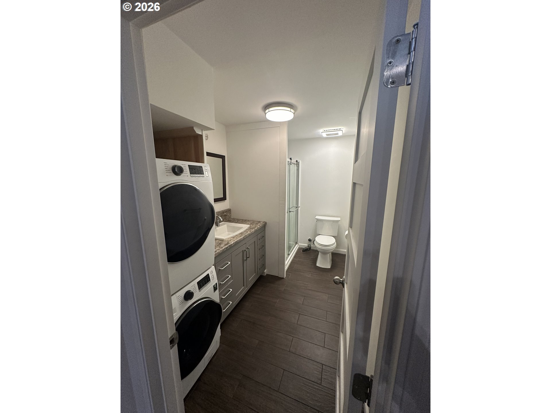 144 Southeast 85th Avenue Portland, OR 97216 - Photo 31 of 43 a view of a hallway with washer and dryer