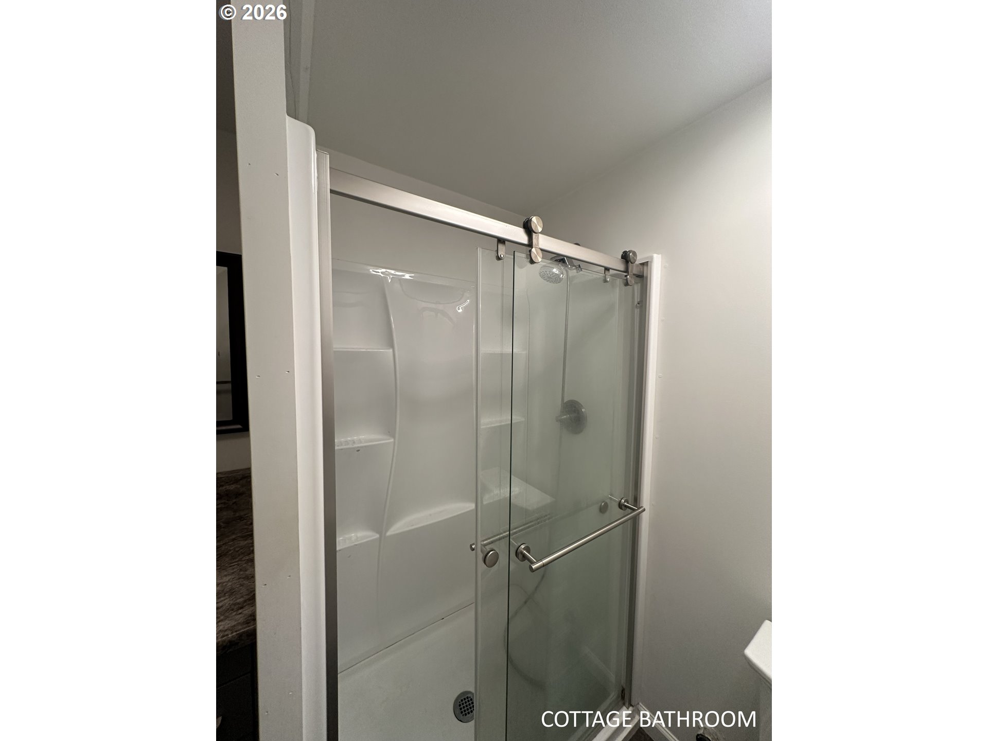 144 Southeast 85th Avenue Portland, OR 97216 - Photo 43 of 43 a bathroom with a shower and a room