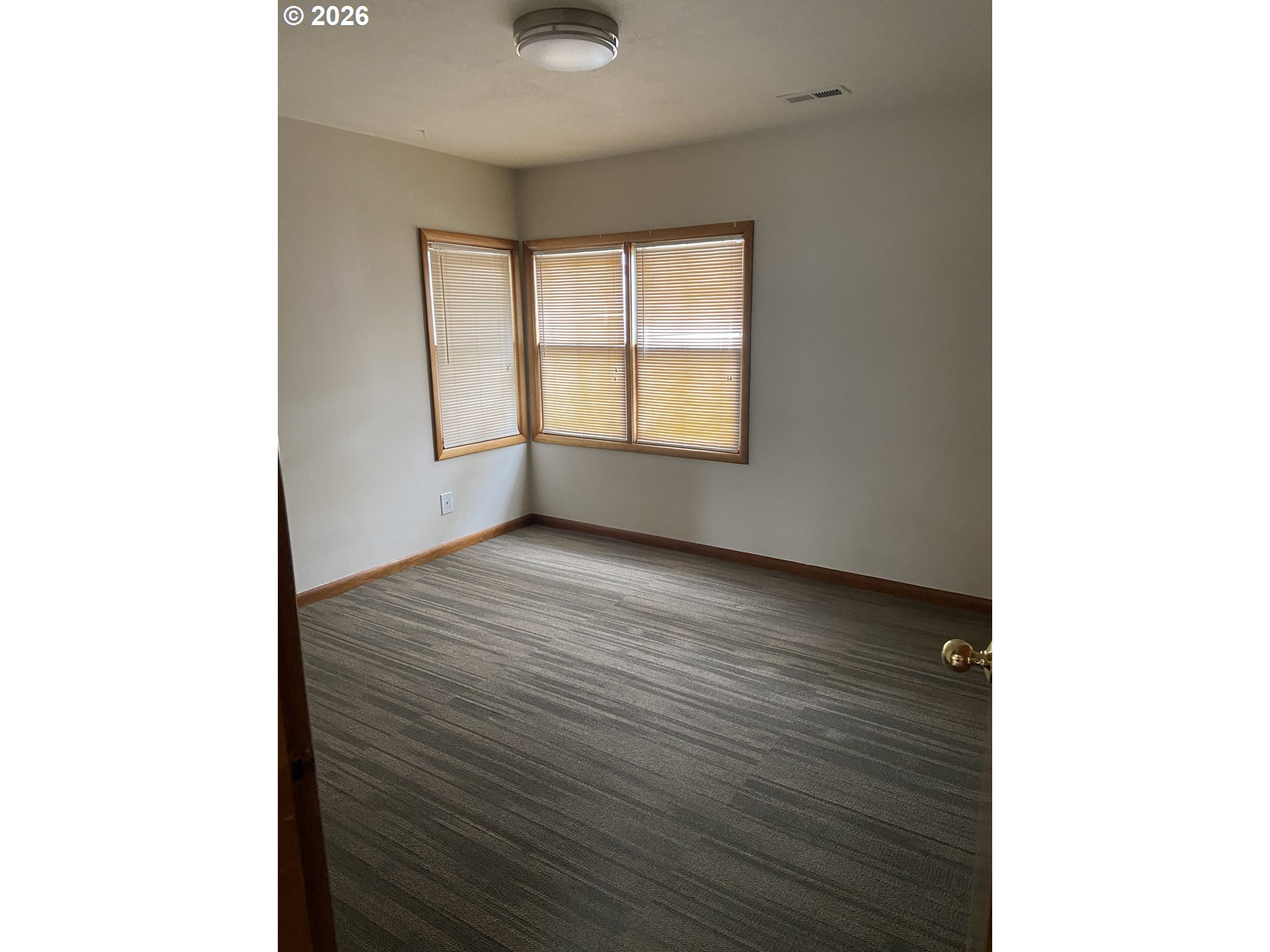 144 Southeast 85th Avenue Portland, OR 97216 - Photo 9 of 43 a view of an empty room with a window
