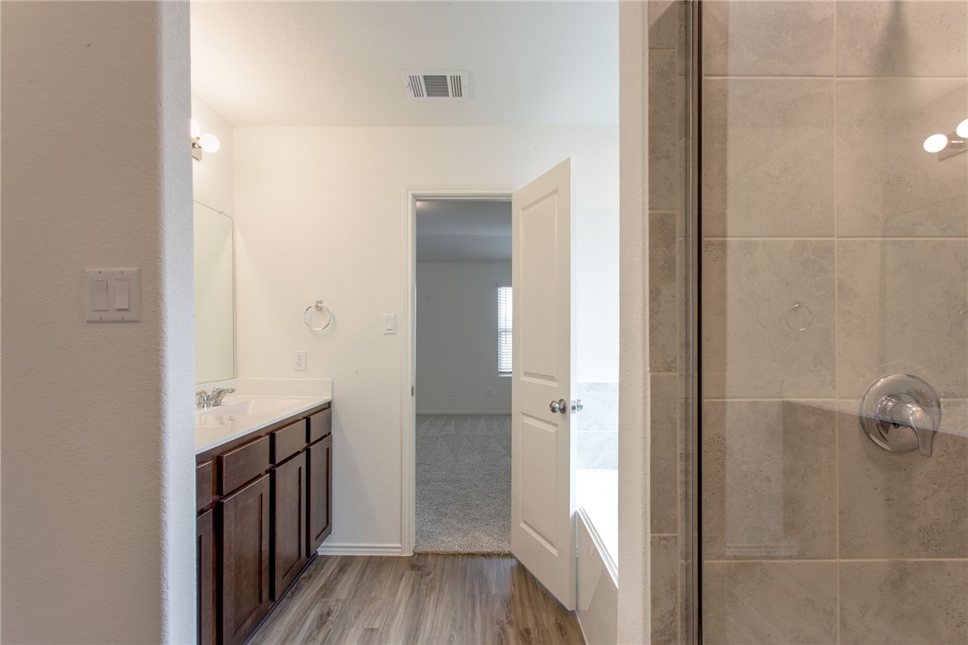 3417 Pauling Loop Round Rock, TX 78665 - Photo 19 of 31 a view of a hallway with wooden floor