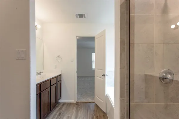 a bath tub sitting next to a window