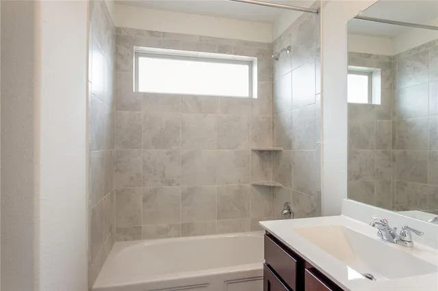 a bathroom with a sink and a bathtub