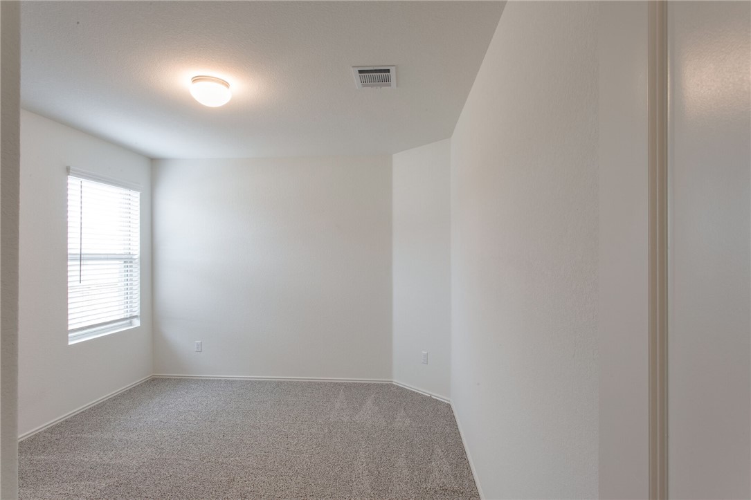 3417 Pauling Loop Round Rock, TX 78665 - Photo 23 of 31 a view of an empty room with a window