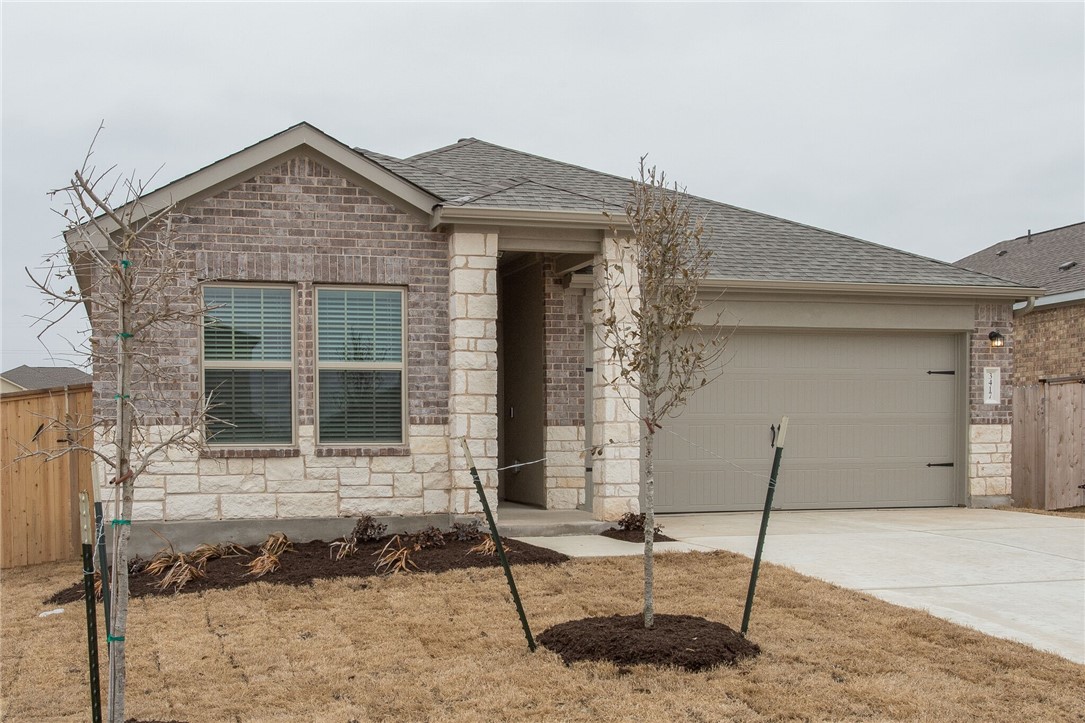 3417 Pauling Loop Round Rock, TX 78665 - Photo 3 of 31 a front view of a house with a porch