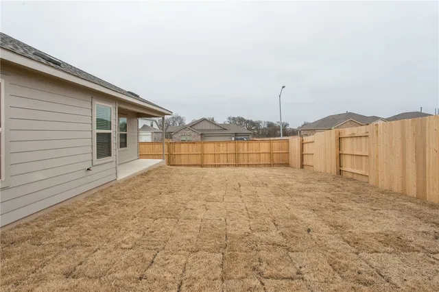 a view of backyard of house