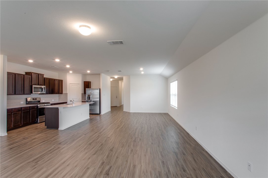 3417 Pauling Loop Round Rock, TX 78665 - Photo 9 of 31 a view of a kitchen with a sink and a stove top oven
