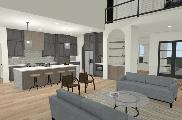 a living room with furniture a wooden floor and kitchen view