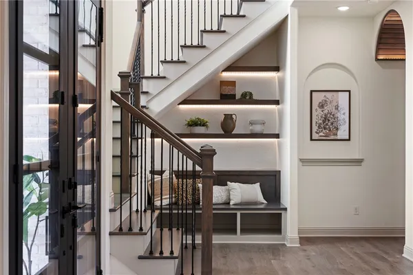 a view of entryway and hall with wooden floor