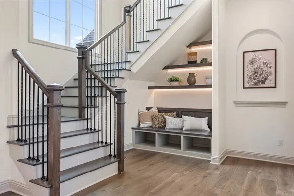 a living room with fireplace furniture and a floor to ceiling window