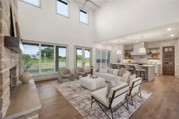 a living room with furniture and a fireplace