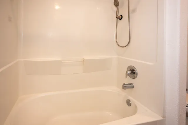 a bathroom with a bath tub