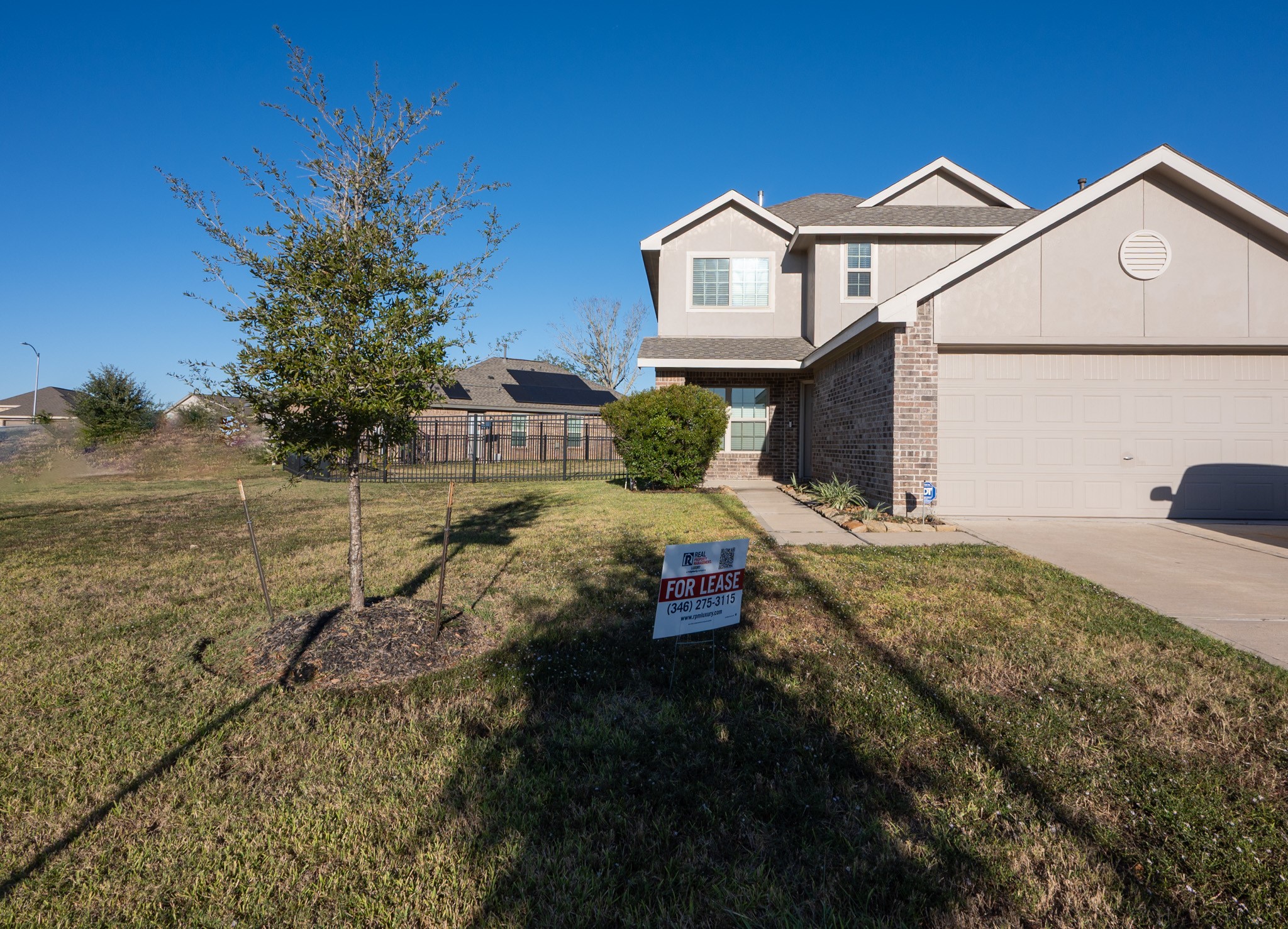 5403 Rosser Ruby Way Brookshire, TX 77423 - Photo 2 of 39 a front view of a house with a yard