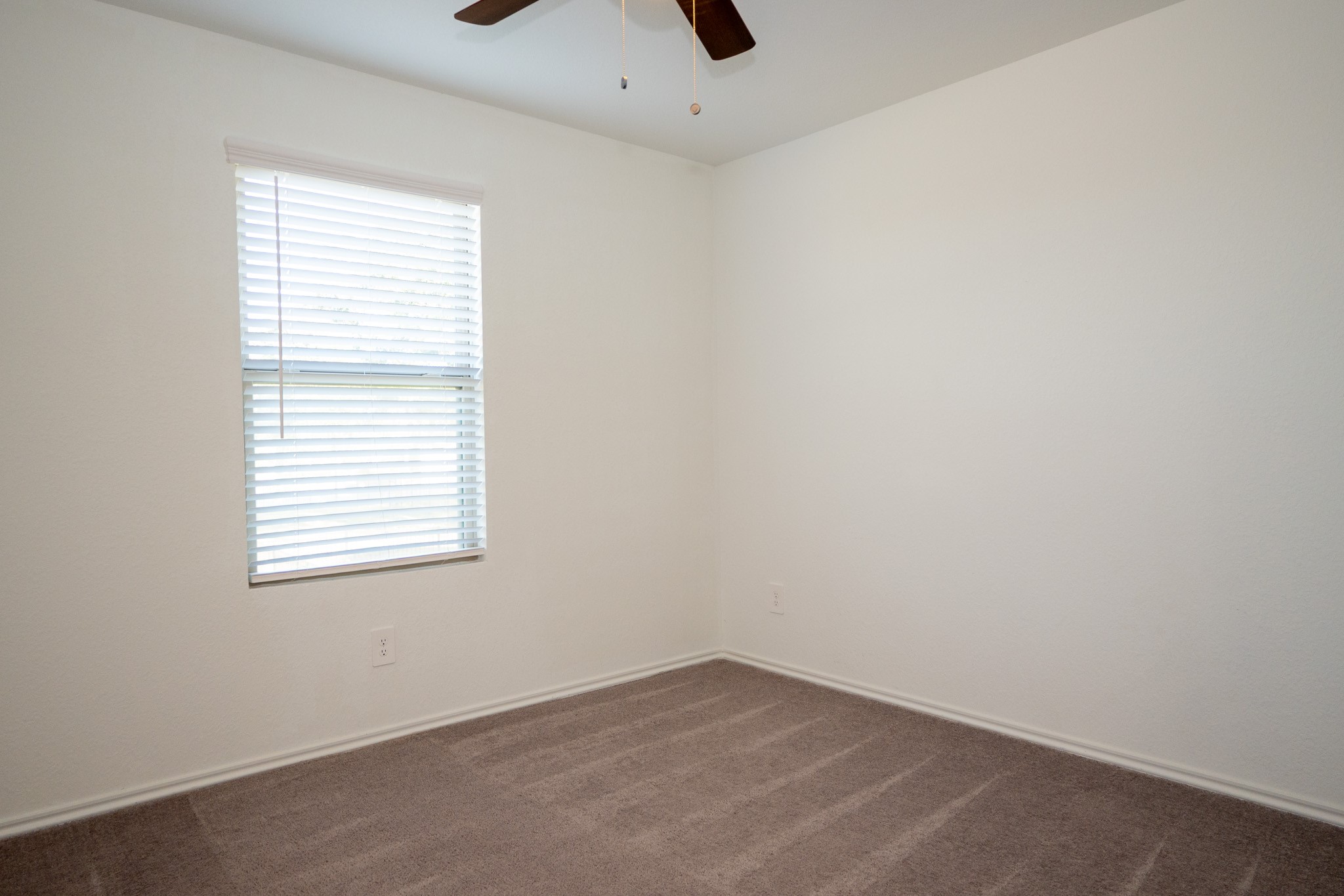 5403 Rosser Ruby Way Brookshire, TX 77423 - Photo 24 of 39 an empty room with a window