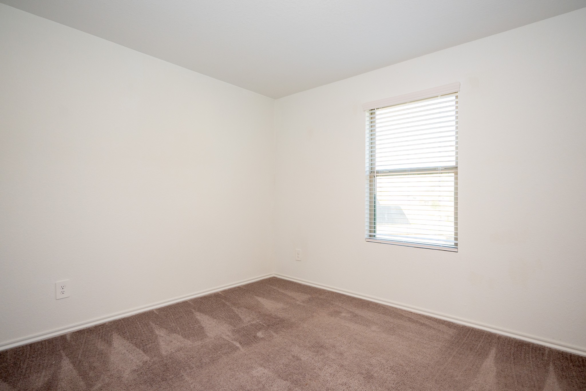 5403 Rosser Ruby Way Brookshire, TX 77423 - Photo 30 of 39 an empty room with a window