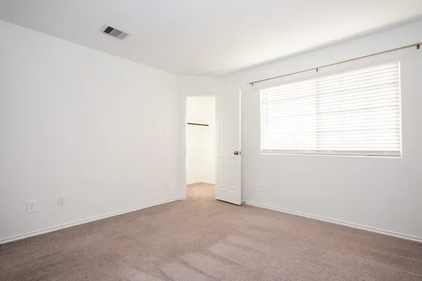 a small space with a window and a shower