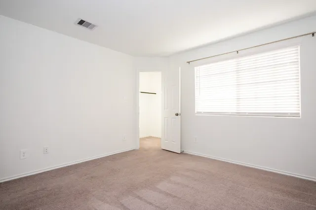 a small space with a window and a shower