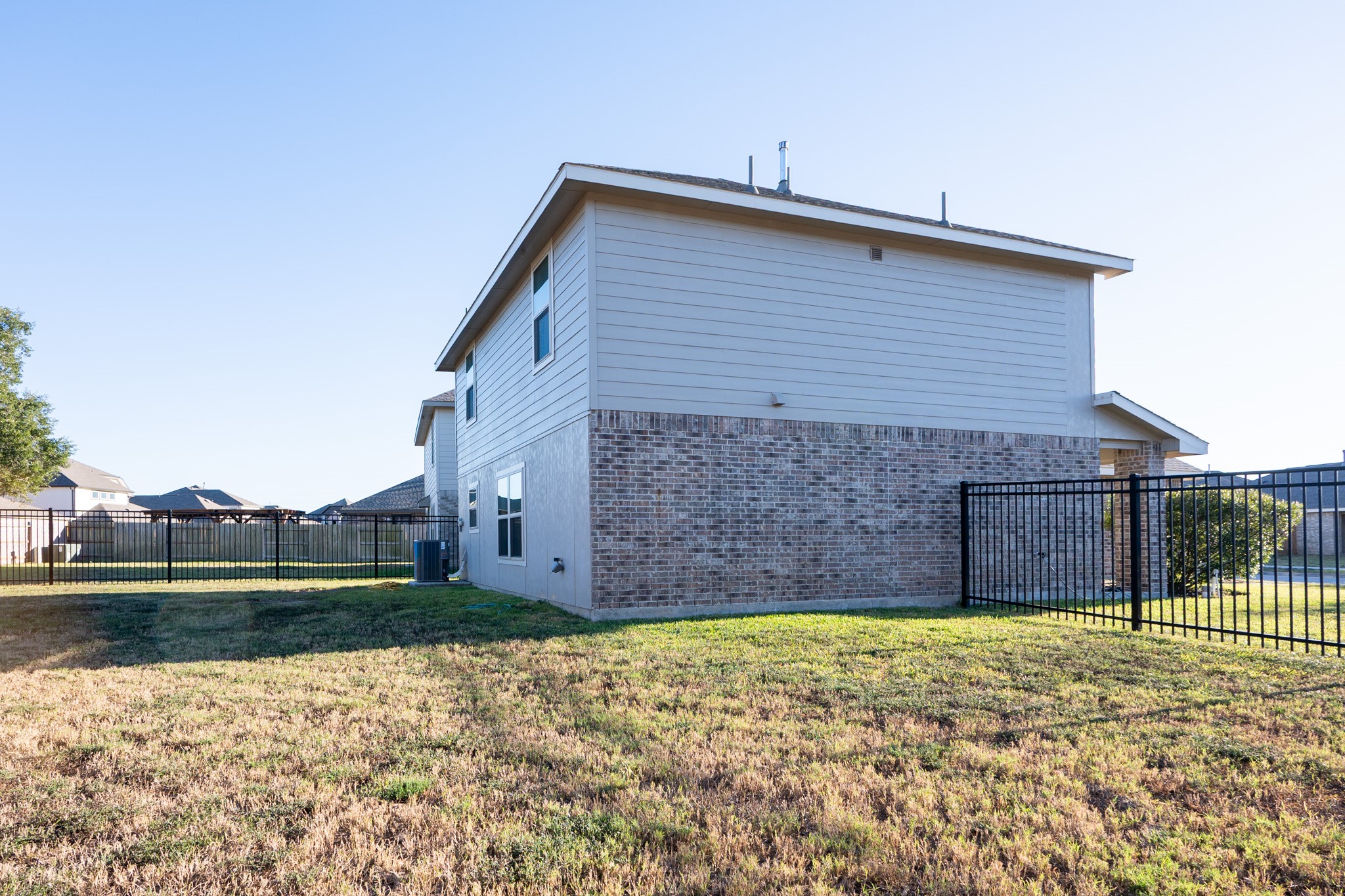 5403 Rosser Ruby Way Brookshire, TX 77423 - Photo 39 of 39 a view of a backyard with a garden