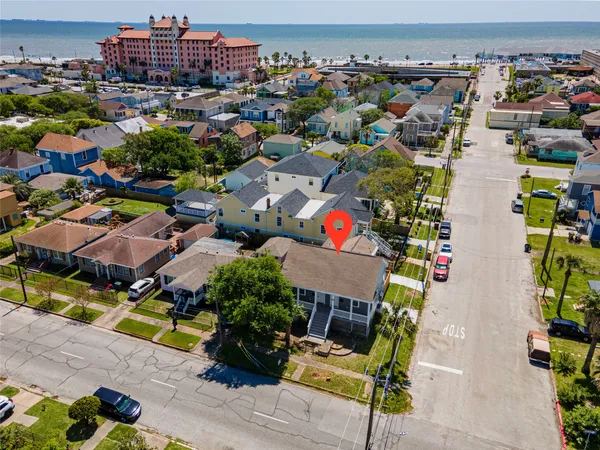 an aerial view of a houses with yard