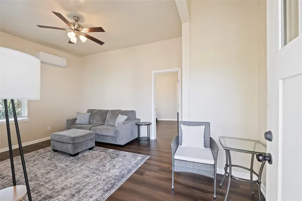 a living room with furniture and a rug